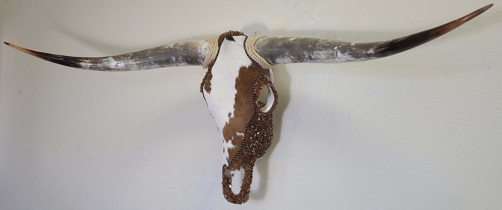 Authentic Longhorn Skull with Brown & White Cowhide & Copper Glass